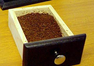 After the coffee is ground in the hand grinder